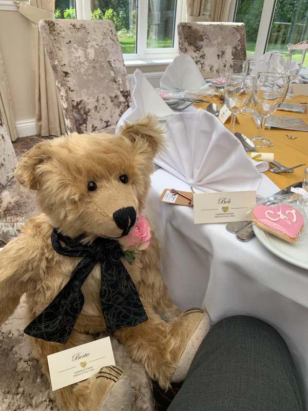 Bertie at the wedding breakfast table with his own place card.